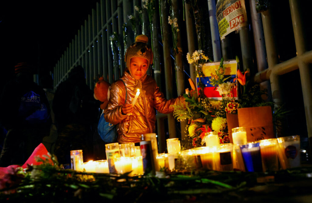 Fatima Pavon, 12, a migrant girl from Venezuela take part in a vigil outside the office of the National Institute of Migration (INM) in memory of the victims of a fire that broke out late on Monday at a migrant detention center, in Ciudad Juarez, Mexico, March 28, 2023. REUTERS/Jose Luis Gonzalez