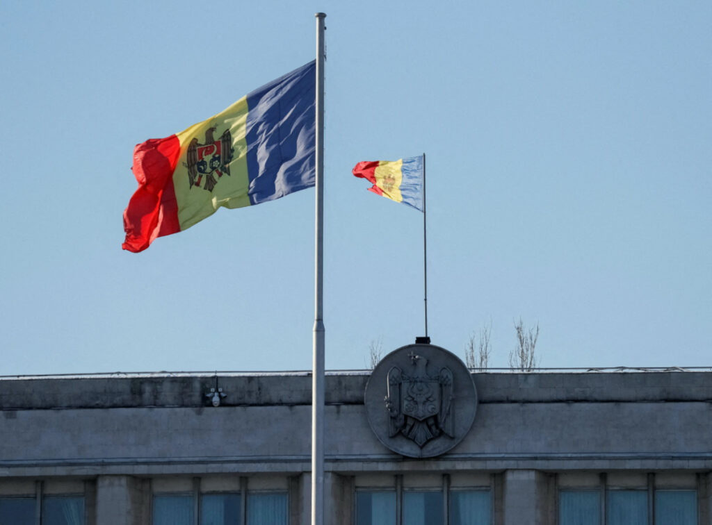 FILE PHOTO: Two Moldovan national flags are seen in central Chisinau, Moldova January 19, 2019. Picture taken January 19, 2019. REUTERS/Gleb Garanich