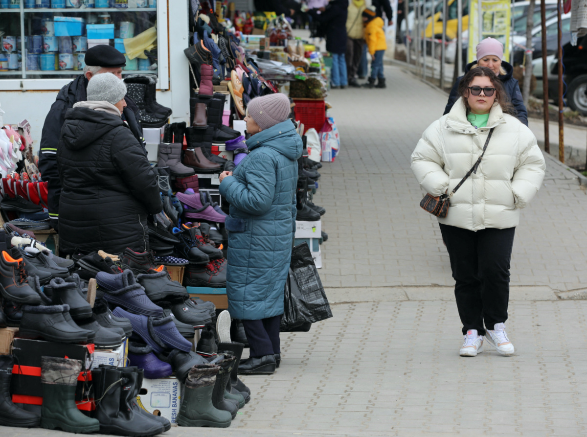 A woman walks through a local market in Comrat, the capital of the autonomous region of Gagauzia, Moldova March 2, 2023.