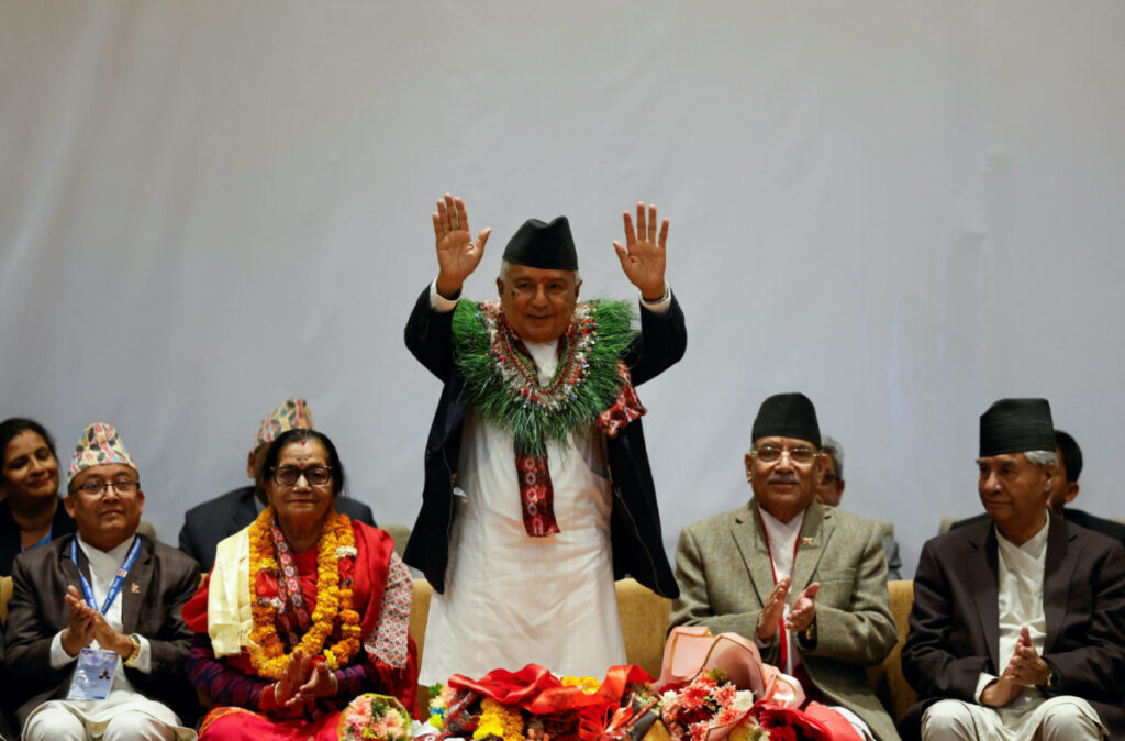 Newly-elected President Ram Chandra Paudel waves towards the media after being elected as the third president of Nepal at the Parliament in Kathmandu, Nepal March 9, 2023.
