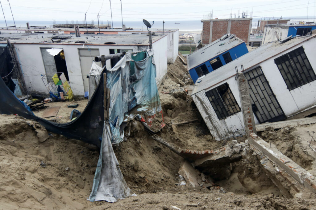 View of damaged houses in the aftermath of the Moche river overflowing due to torrential rains caused by Cyclone Yaku, in Trujillo, Peru, March 13, 2023.
