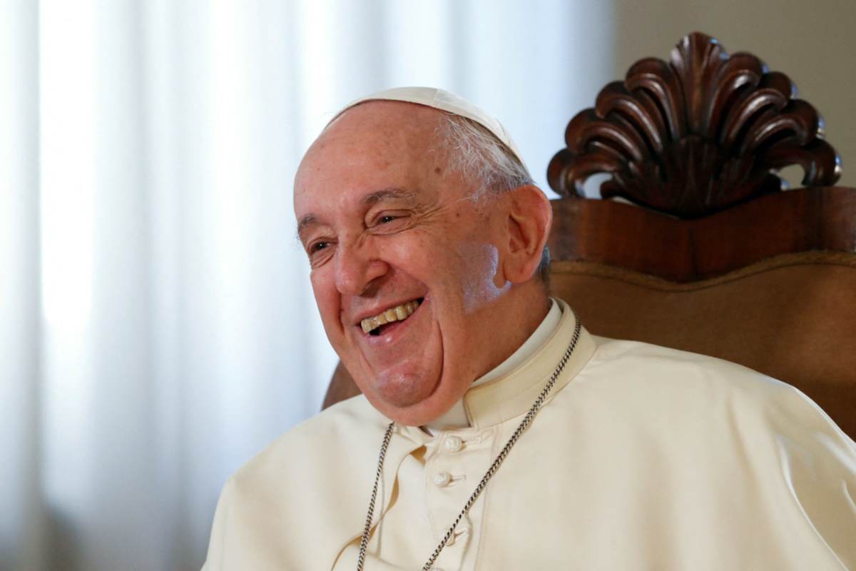 FILE PHOTO: Pope Francis smiles during an exclusive interview with Reuters, at the Vatican, July 2, 2022. REUTERS/Remo Casilli/File Photo