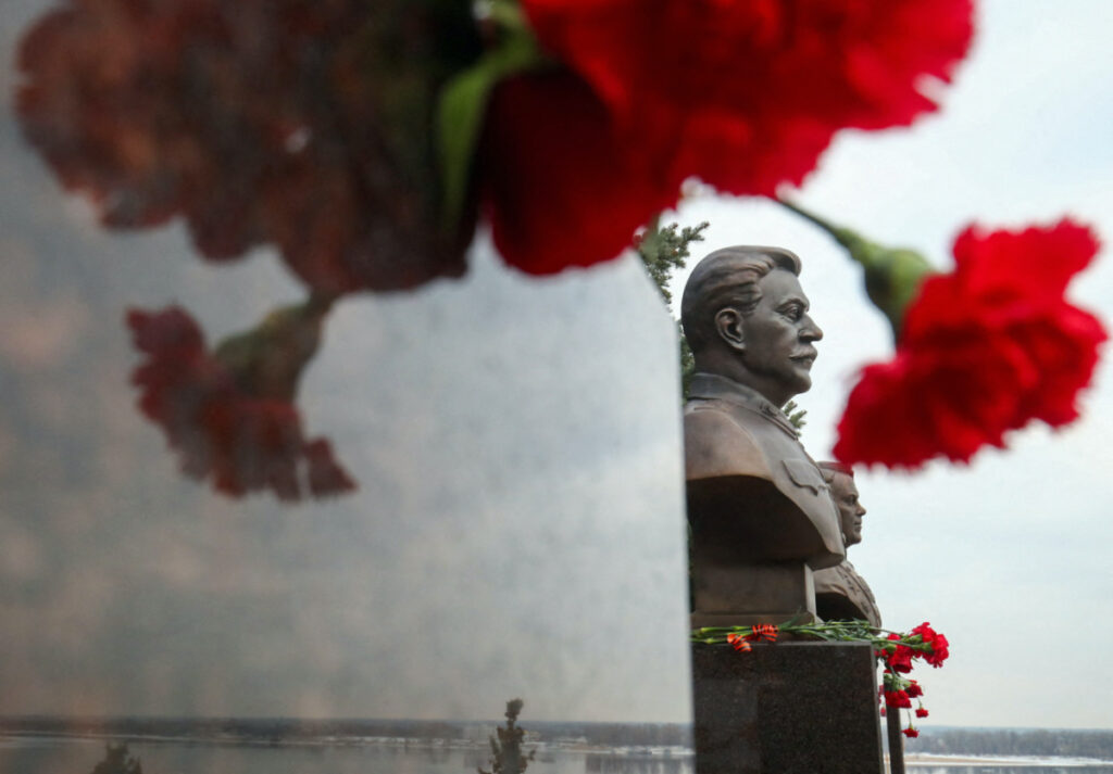 Red carnations are placed under the bronze busts of Soviet military commanders Josef Stalin and Alexander Vasilyevsky, which were recently unveiled to mark the 80th anniversary of the Red Army's defeat of Nazi Germany's troops in the Battle of Stalingrad that became the deadliest and one of the most decisive fightings during World War Two, at a panorama museum in Volgograd, Russia, February 3, 2023. REUTERS/Kirill Braga