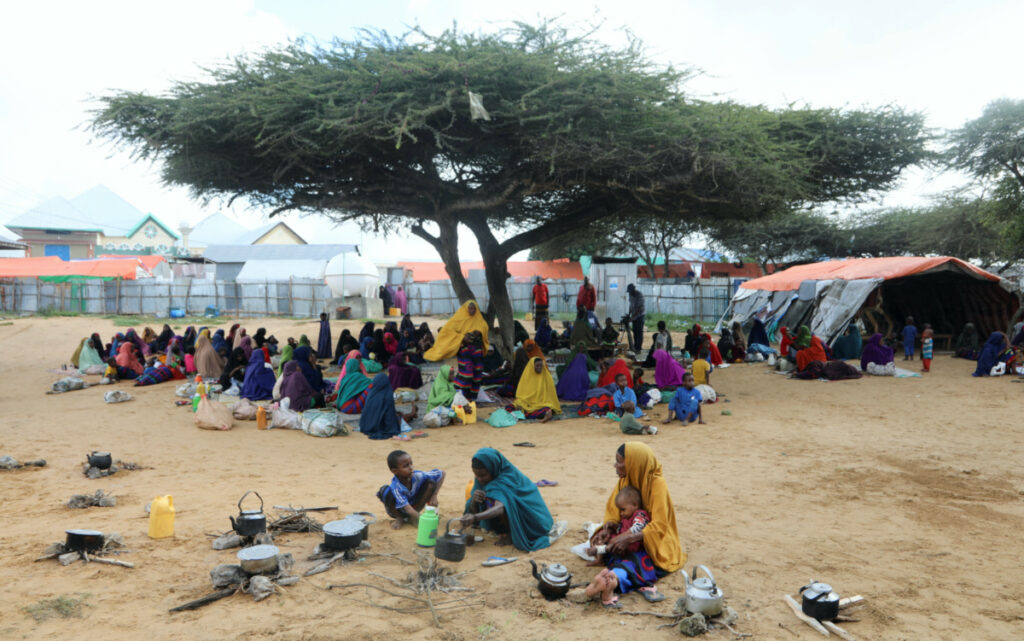 People affected by the worsening drought due to failed rain seasons, gather at the Alla Futo camp for internally displaced people, in the outskirts of Mogadishu, Somalia September 23, 2022.