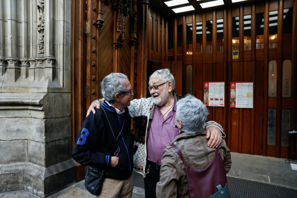 Priest Josu Lopez Villalba, a sexual abuse victim, talks to people, after a mass, by the Bishop of Bilbao, Joseba Segura and priest Villalba, where forgiveness was asked for from victims of sexual abuse by the Catholic Church, in Bilbao, Spain, March 24, 2023. REUTERS/Vincent West