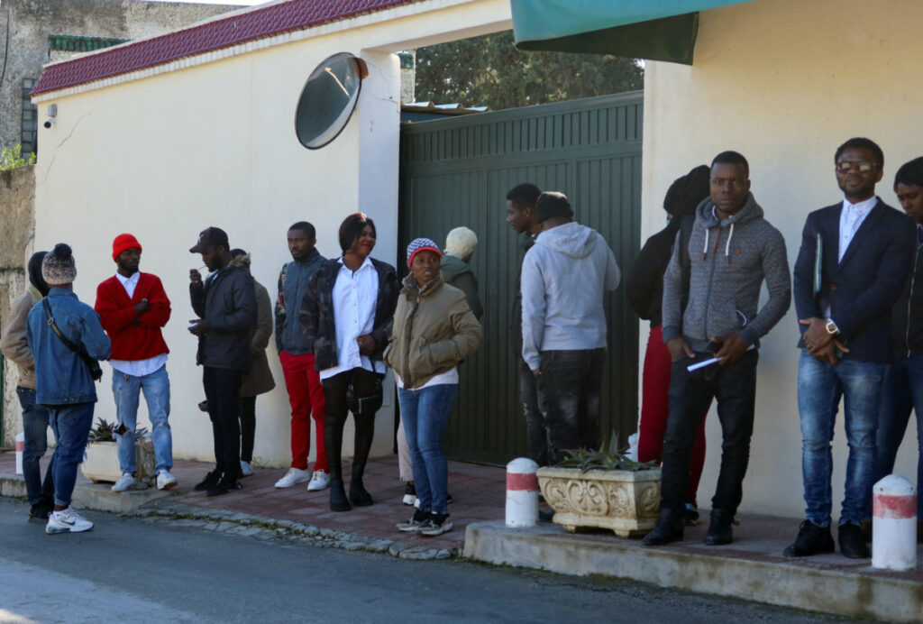 Ivory Coast nationals living in Tunisia and seeking repatriation, wait outside the embassy of Ivory Coast in Tunis, Tunisia February 27, 2023