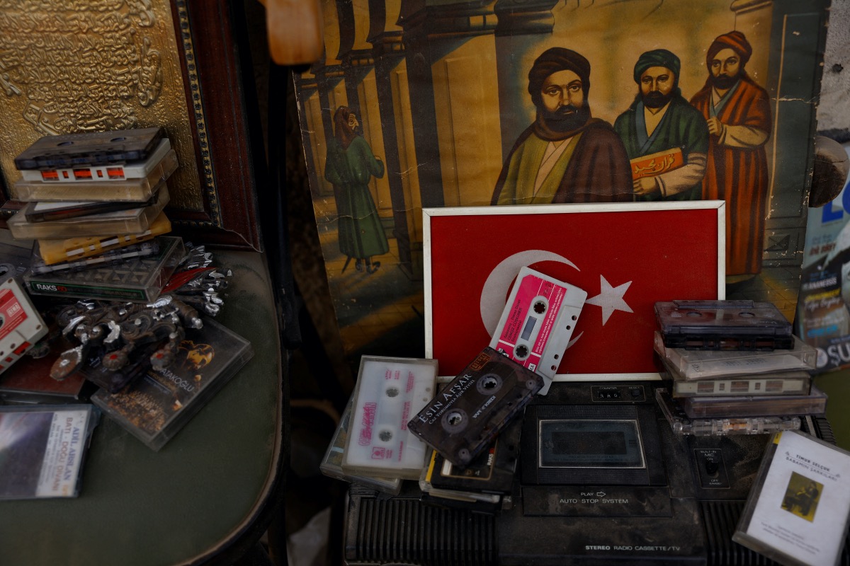 Music tapes are seen on a player at an exhibition outside Mehmet Serkan Sincan's antique shop in the aftermath of a deadly earthquake, in Antakya, Hatay province, Turkey, March 2, 2023. 