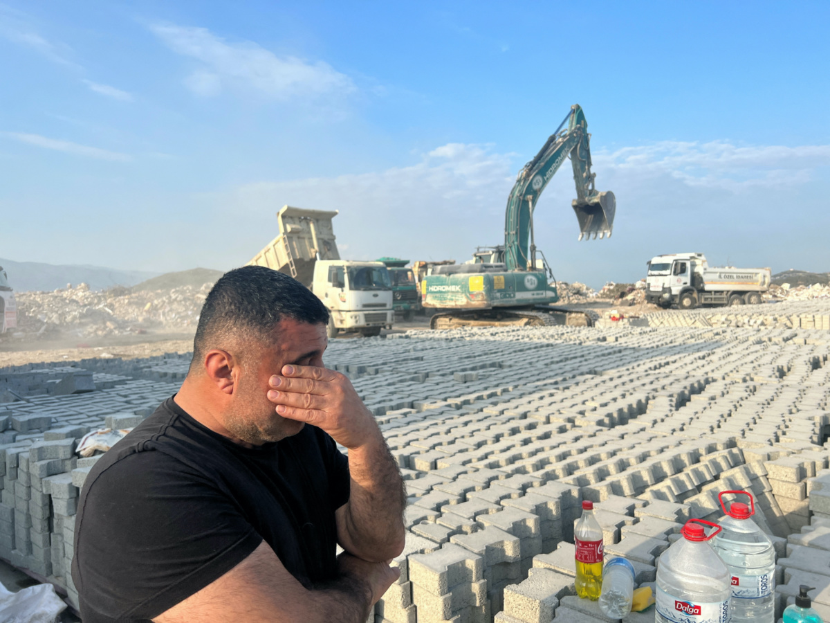 Altan Arslan, owner of a brick and cement block factory where post-earthquake rubble is dumped, reacts as he talks to Reuters on the outskirts of Antakya in Hatay province, Turkey February 25, 2023. 