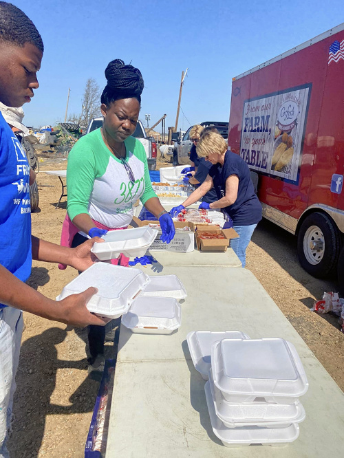 Volunteers with Catfish Navy prepare meals for local residents and first responders in Silver City, Mississippi. Courtesy photo