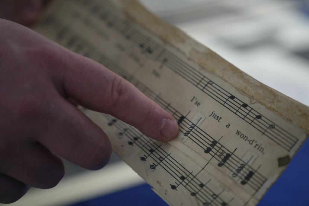Christopher Lynch, music historian with the Center for American Music at the University of Pittsburgh, holds a piece of sheet music written by Charles Henry Pace, on Tuesday, on 18th February, 2023, at the University of Pittsburgh, in Pittsburgh.