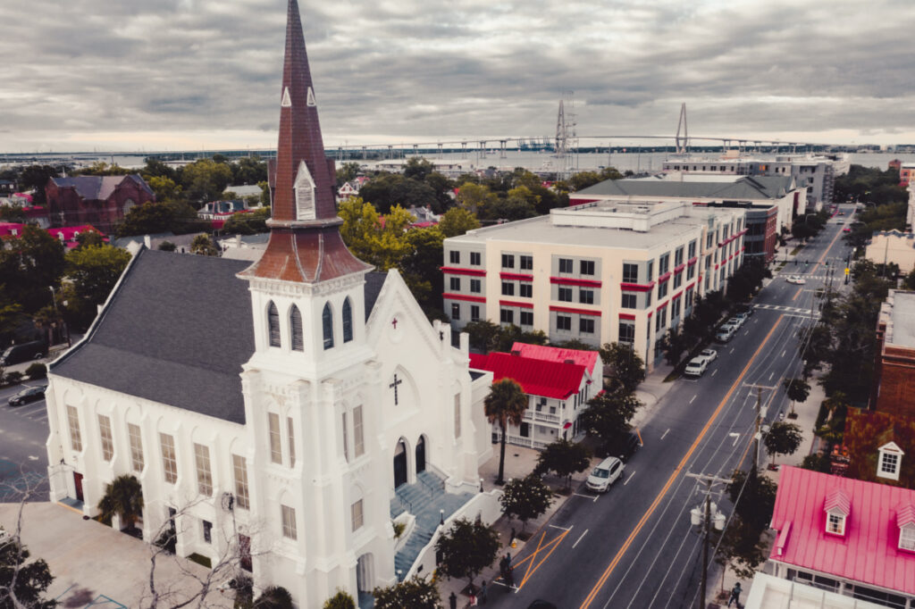Charleston, SC / USA - June 17, 2020: Mother Emanuel AME Church against the Charleston skyline on the 5th anniversary of the murder of 9 Bible study goers by Dylann Roof