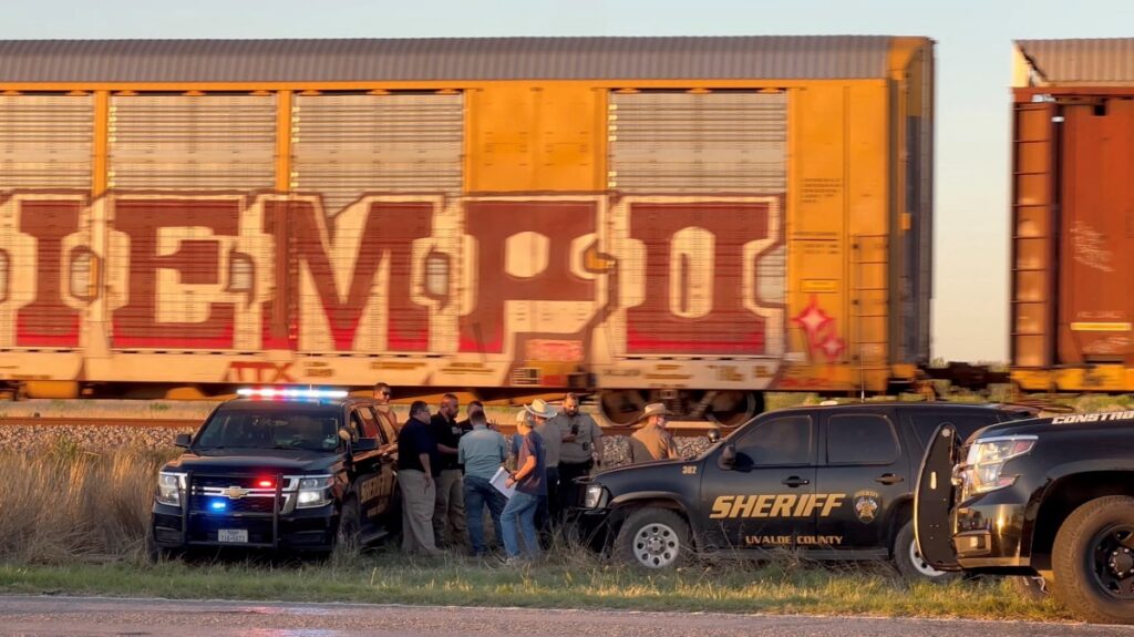 Members of the police work, after two migrants suffocated to death aboard a freight train that got derailed, in Uvalde, Texas, US, on 24th March, 2023, in this screengrab obtained from a social media video.