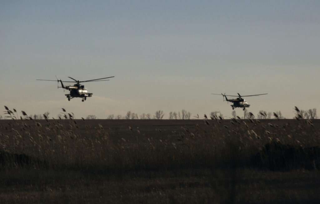FILE PHOTO: Ukrainian Armed Forces helicopters fly over a field outside the frontline town of Bakhmut, amid Russia's attack on Ukraine, in Donetsk region, Ukraine March 5, 2023. REUTERS/Anna Kudriavtseva