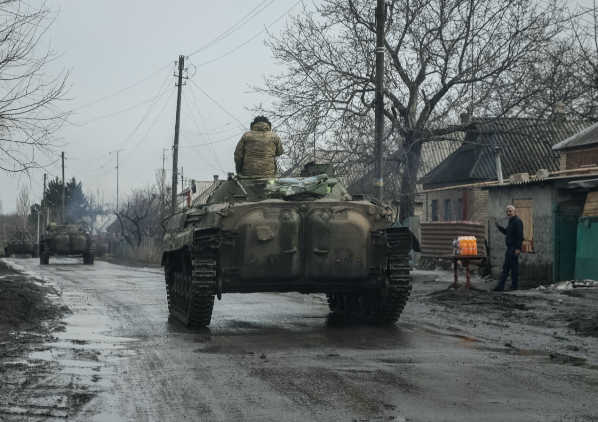 FILE PHOTO: Ukrainian service members ride BMP-2 infantry fighting vehicles, as Russia's attack on Ukraine continues, near the frontline city of Bakhmut, Ukraine February 27, 2023. REUTERS/Yevhen Titov