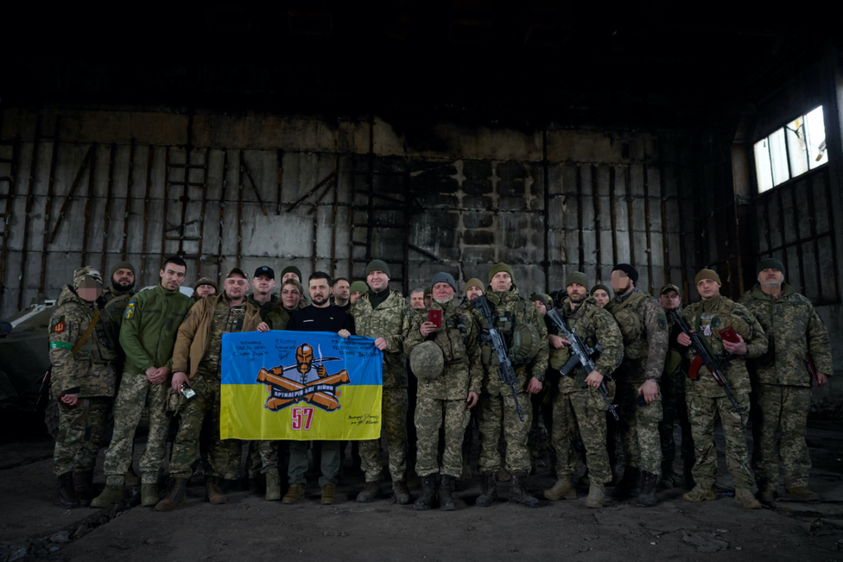 Ukraine's President Volodymyr Zelenskiy poses for a picture with Ukrainian service members at a position near a frontline, amid Russia's attack on Ukraine, in Donetsk region, Ukraine March 22, 2023. Ukrainian Presidential Press Service/Handout via REUTERS