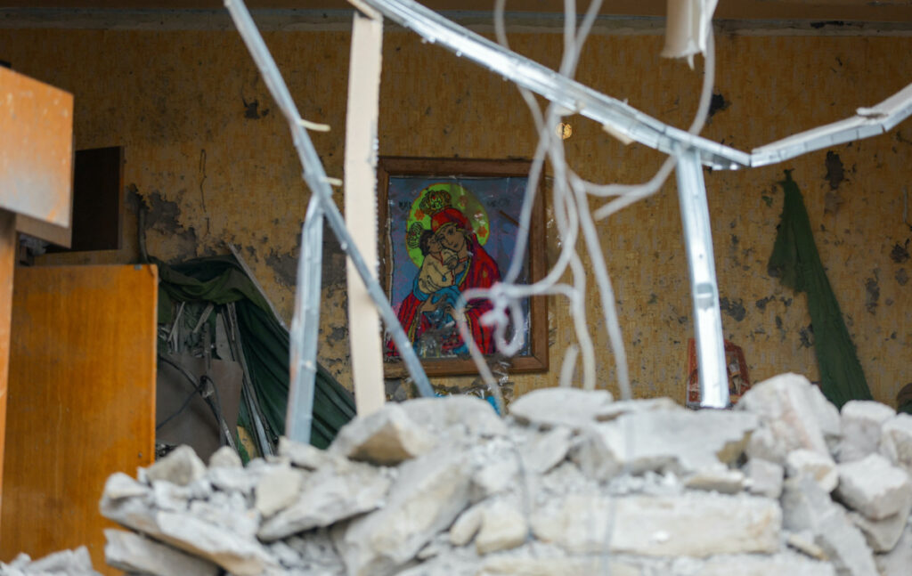 A view shows an icon knit inside a house destroyed in recent shelling in the course of Russia-Ukraine conflict in Donetsk, Russian-controlled Ukraine, March 12, 2023. REUTERS/Alexander Ermochenko