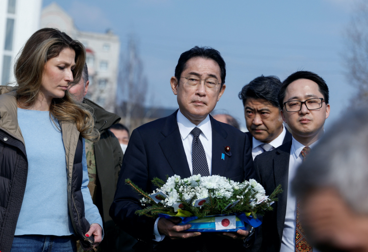 Japanese Prime Minister Fumio Kishida visits a site of a mass grave, in the town of Bucha, amid Russia's attack on Ukraine, outside of Kyiv, Ukraine March 21, 2023. REUTERS/Valentyn Ogirenko