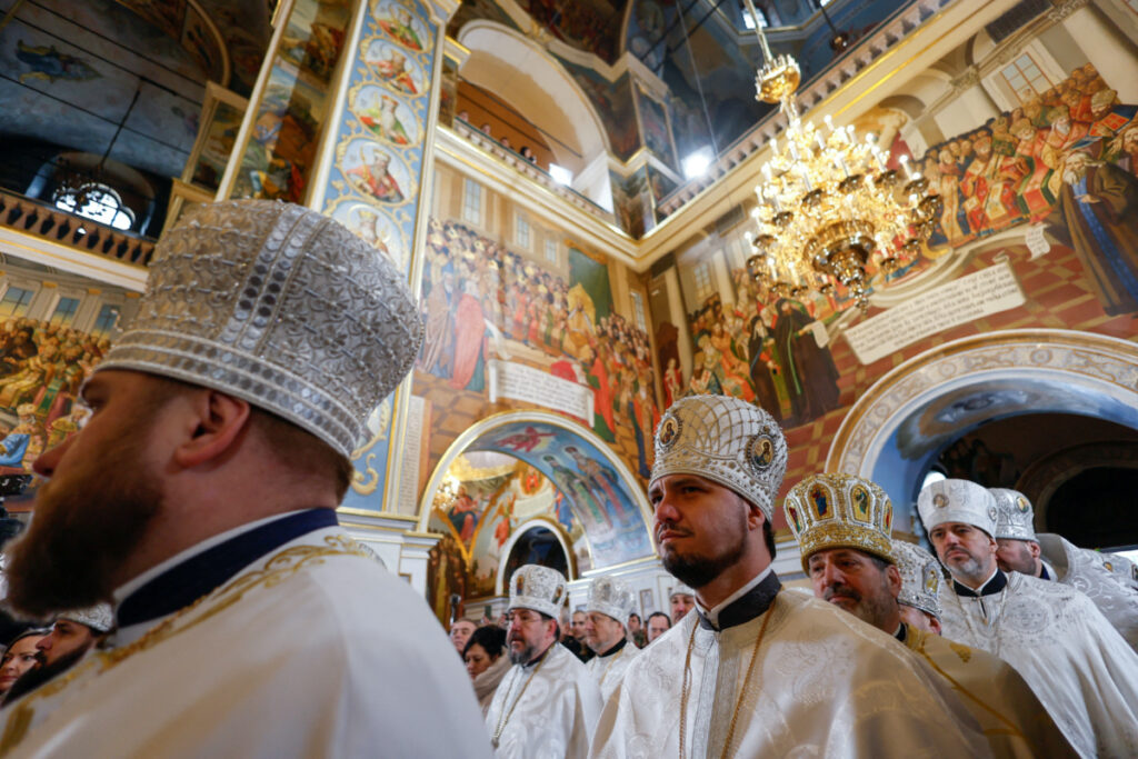 FILE PHOTO: Orthodox priests of the Orthodox Church of Ukraine conduct a Christmas service inside Uspenskyi (Holy Dormition) Cathedral, at the compound of the Kyiv Pechersk Lavra monastery, previously used by Ukrainian Orthodox Church branch loyal to Moscow, amid Russia's attack on Ukraine, in Kyiv, Ukraine January 7, 2023. REUTERS/Valentyn Ogirenko/File Photo