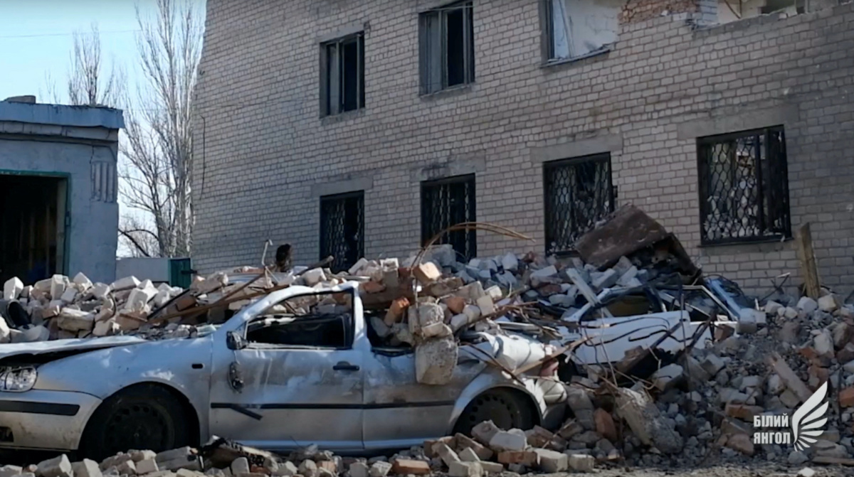 FILE PHOTO: A general view shows a car damaged by debris, amid Russia's attack on Ukraine, in Avdiivka, Donetsk Region, Ukraine, March 15, 2023, in this screen grab obtained from a video. Donetsk Region Police/Handout via REUTERS/File Photo