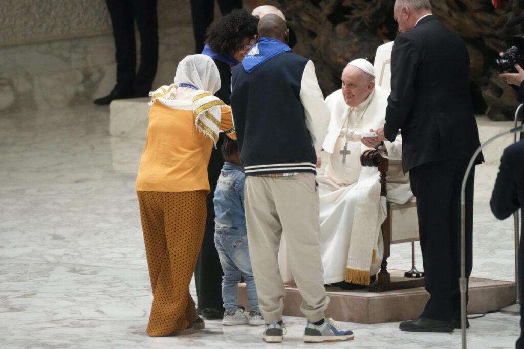 Pope Francis meets with refugee families in the Paul VI hall at the Vatican, on Saturday, 18th March, 2023.