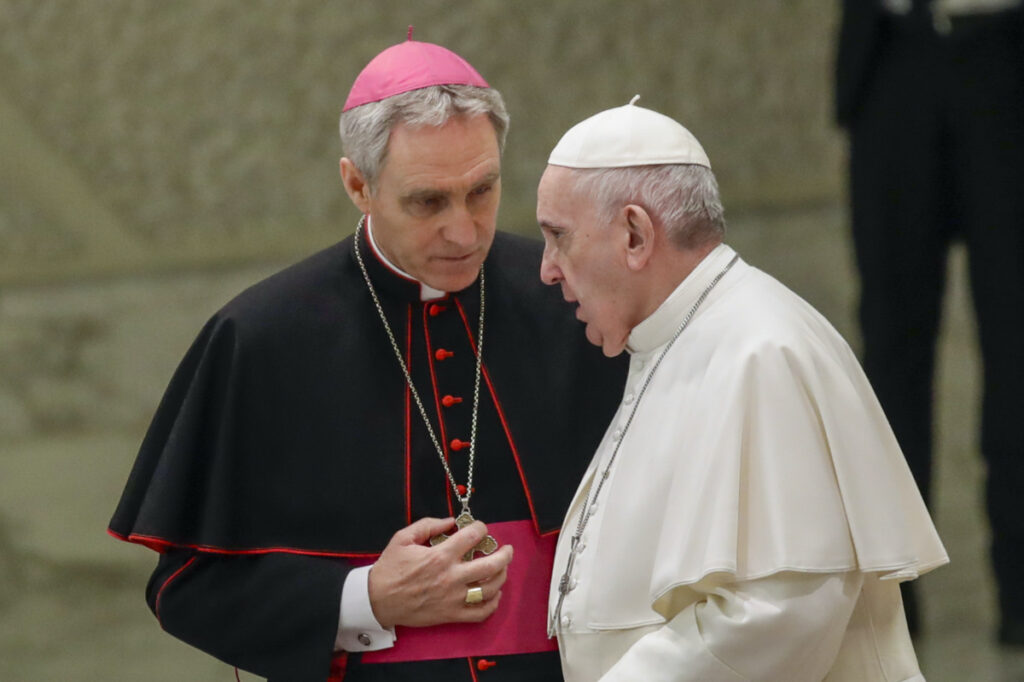 Pope Francis talks with Papal Household Archbishop Georg Gaenswein during his weekly general audience, in Paul VI Hall at the Vatican, on 15th January, 2020.
