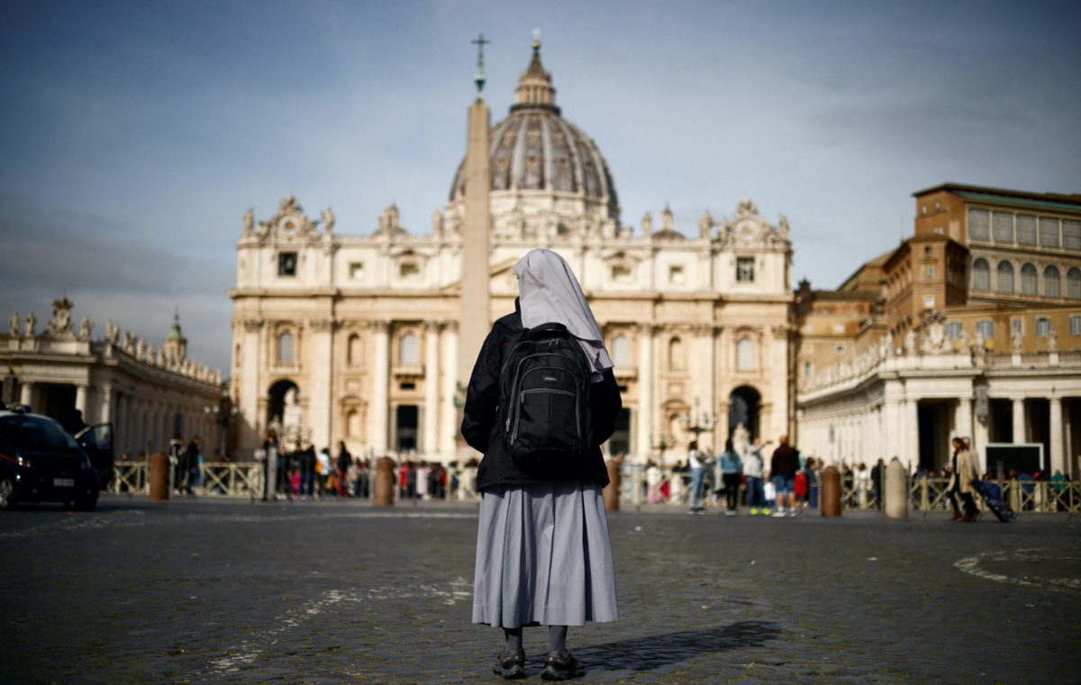 A nun stands in front of St. Peter’s square after Pope Francis was hospitalised for a respiratory infection, at the Vatican March 30, 2023. REUTERS/Yara Nardi     TPX IMAGES OF THE D