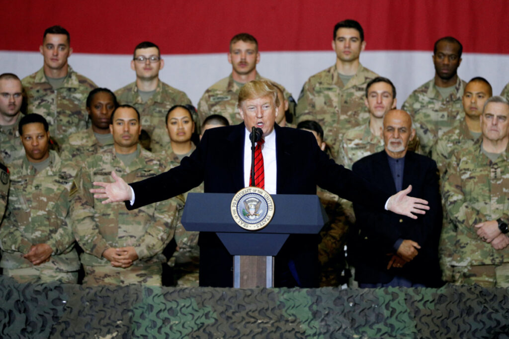 US President Donald Trump delivers remarks to US troops, with Afghanistan President Ashraf Ghani standing behind him, during an unannounced visit to Bagram Air Base, Afghanistan, on 28th November, 2019