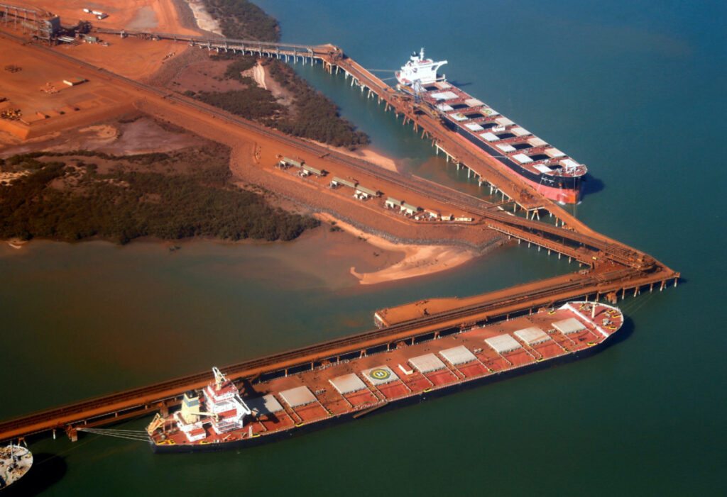 Ships waiting to be loaded with iron ore are seen at the Fortescue loading dock located at Port Hedland, in the Pilbara region of Western Australia, on 3rd December, 2013.
