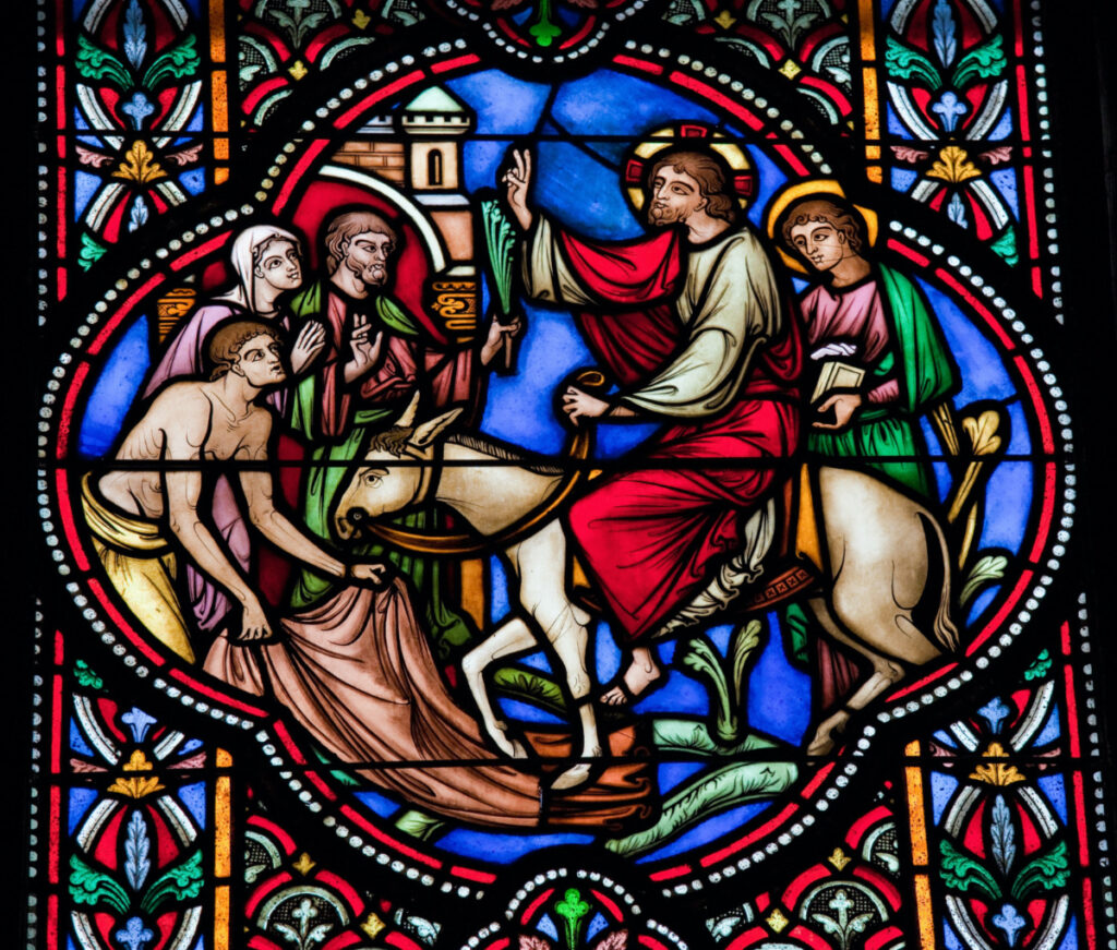 Stained glass window depicting Jesus entering Jerusalem on Palm Sunday, in the cathedral of Brussels on July, 26, 2012.