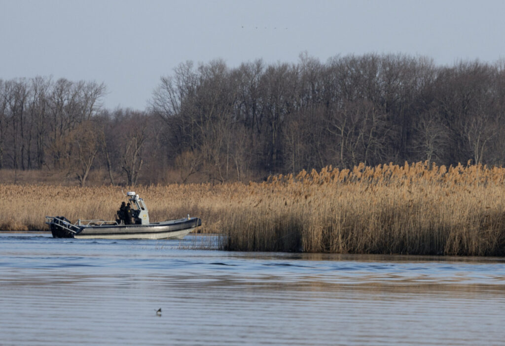 Police search the marshland where bodies were found in Akwesasne, Quebec, Canada, on 31st March, 2023.