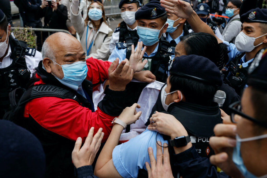 A supporter scuffles with police the West Kowloon Magistrates' Courts building during the hearing of the 47 pro-democracy activists charged with conspiracy to commit subversion under the national security law, in Hong Kong, China, on 6th February, 2023.