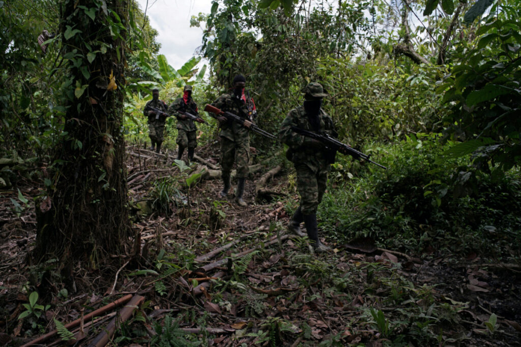 Rebels from Colombia's Marxist National Liberation Army patrol an area, in the northwestern jungles, Colombia, on 31st August, 2017.