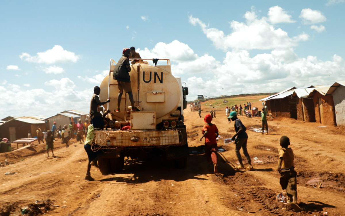Congolese children play as they ride atop a United Nations water truck, in Rhoe camp for the internally displaced people in Djugu's territory, Ituri's province, north-east of the Democratic Republic of Congo on 19th April, 2023.