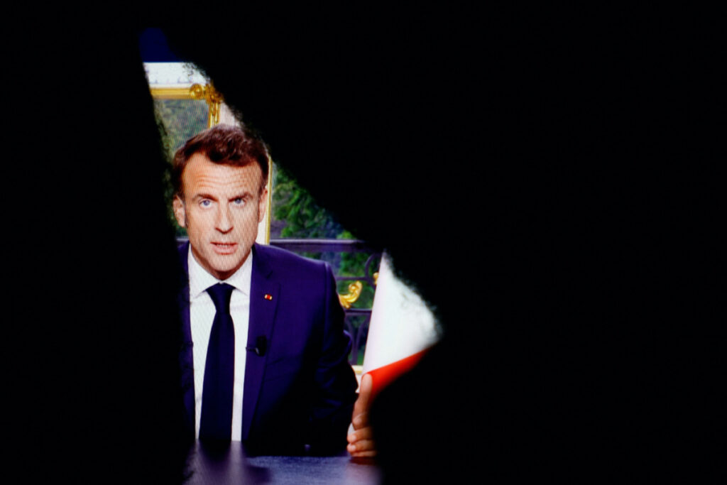 French President Emmanuel Macron appears on a screen, as he speaks during a special address to the nation from the Elysee Palace, after he signed into law the pension reform raising the retirement age, in Paris, France, on 17th April, 2023.