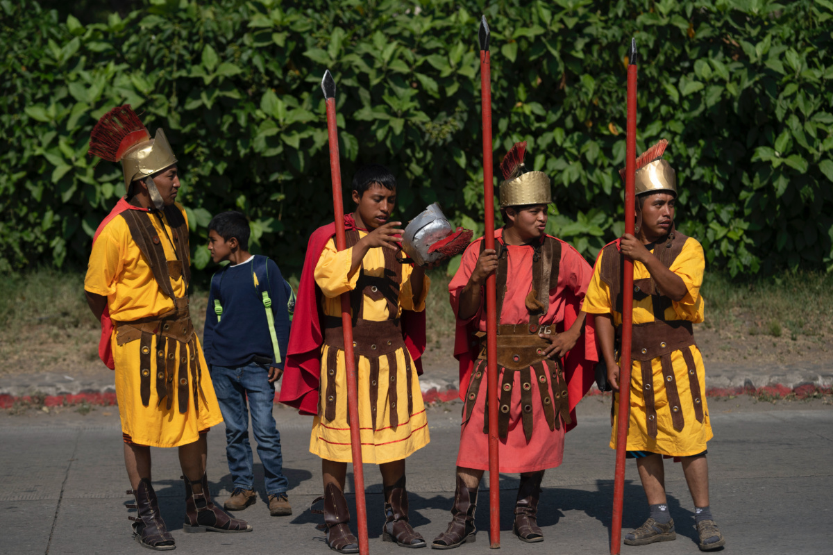 Faithful dressed as Roman soldiers take part in a Holy Thursday procession outside the San Cristobal el Bajo Catholic church, in Antigua, Guatemala, on Thursday, 6th April, 2023.