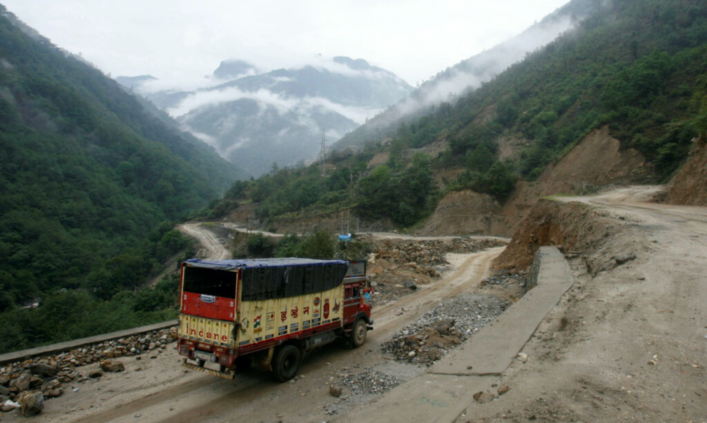 A liquefied petroleum gas delivery truck drives along India's Tezpur-Tawang highway which runs to the Chinese border, in the north-eastern Indian state of Arunachal Pradesh on 29th May, 2012.