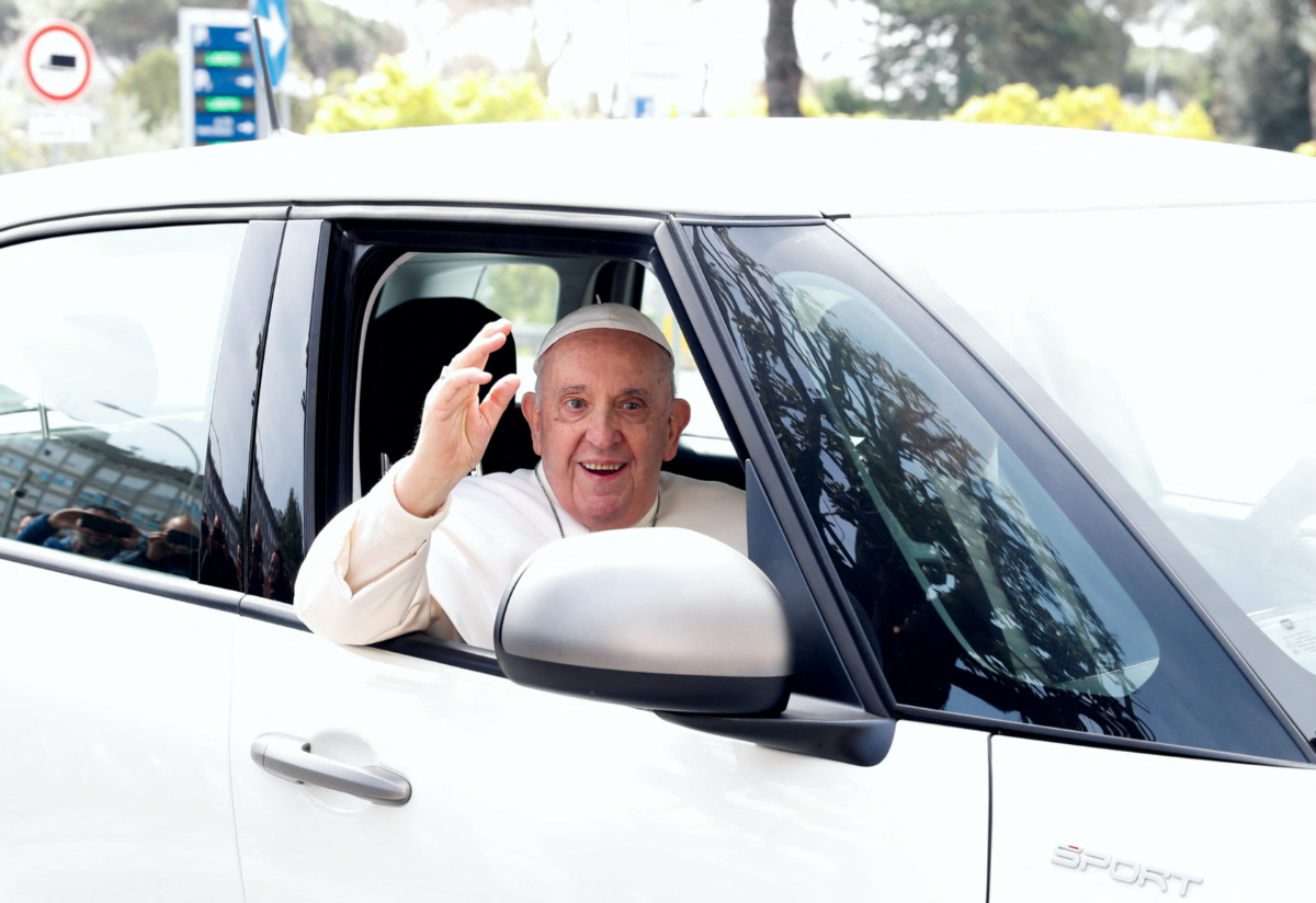 Pope Francis waves from a car as he leaves Rome's Gemelli hospital in Rome, Italy, on 1st April, 2023.