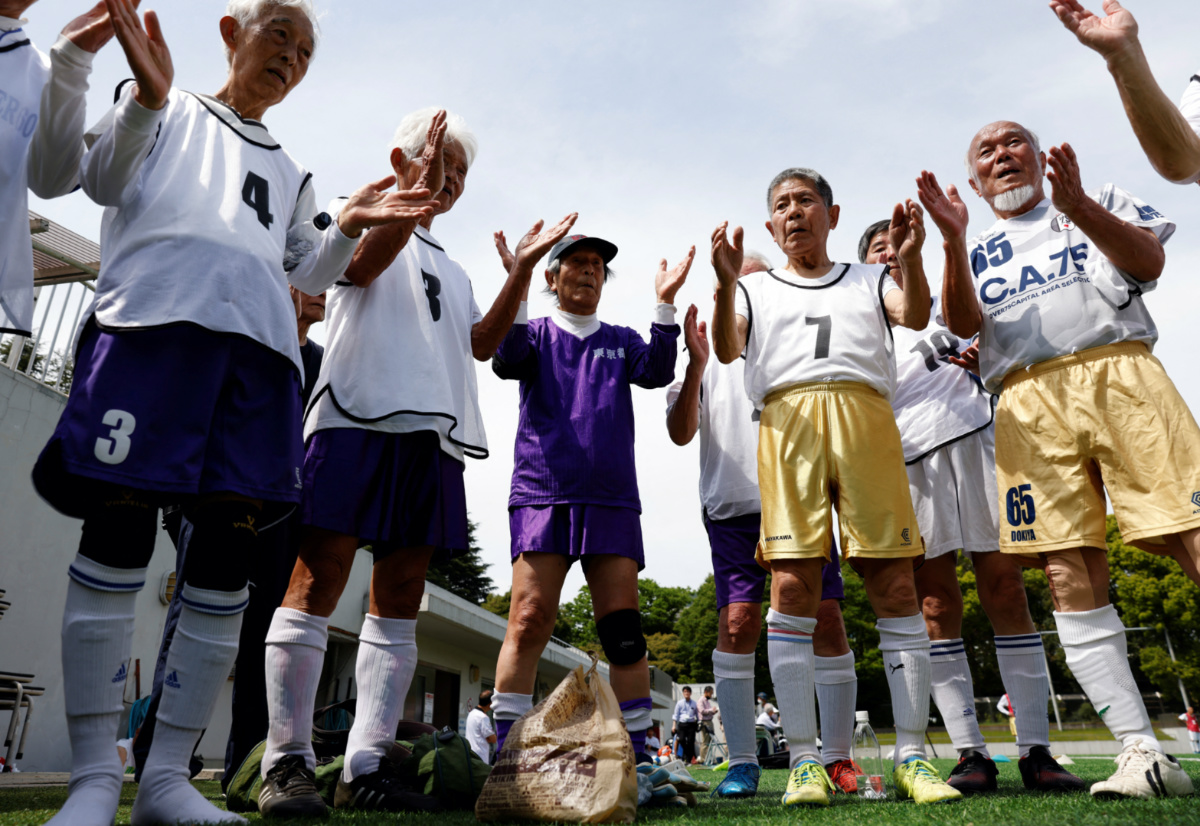 White Bear’s goalkeeper Shingo Shiozawa, 93, claps with his teammates following the Japanese custom 'temije' after the SFL 80 League opening match in Tokyo, Japan, on 12th April 12, 2023. 