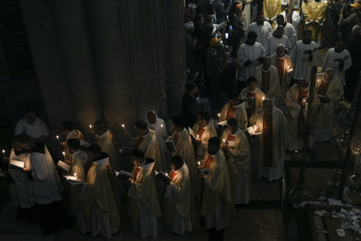 Priests participate in the Easter Sunday Mass led by the Latin Patriarch of Jerusalem Pierbattista Pizzaballa, at the Church of the Holy Sepulchre, where many Christians believe Jesus was crucified, buried and rose from the dead, in the Old City of Jerusalem, on Sunday, 9th April, 2023.