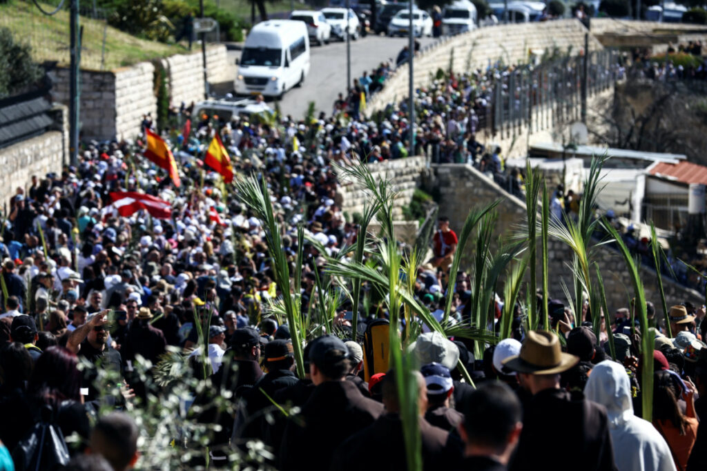Christian worshippers attend a Palm Sunday procession on the Mount of Olives in Jerusalem on 2nd April, 2023.