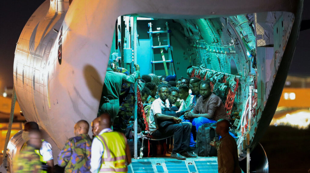 Evacuees from war-torn Sudan sit inside a military plane as they wait to be processed by members of the Kenya Defence Forces upon their arrival at the Jomo Kenyatta International Airport in Nairobi, Kenya, on 24th April, 2023