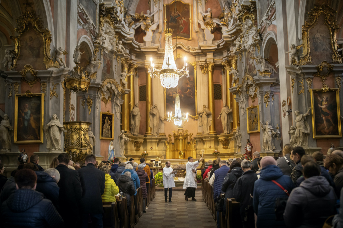 A priest blesses the congregations during an Easter service, at the Church of St Theresa in Vilnius, Lithuania, Saturday, on 8th April, 2023