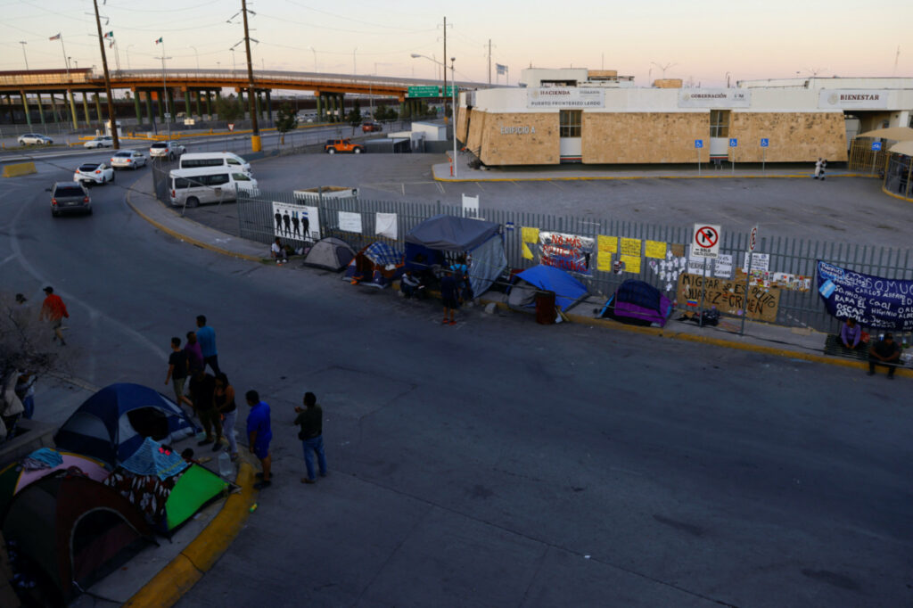 A view shows migrants camp outside the immigration detention centre where several migrants died after a fire broke out at the center, in Ciudad Juarez, Mexico, on 10th April, 2023.