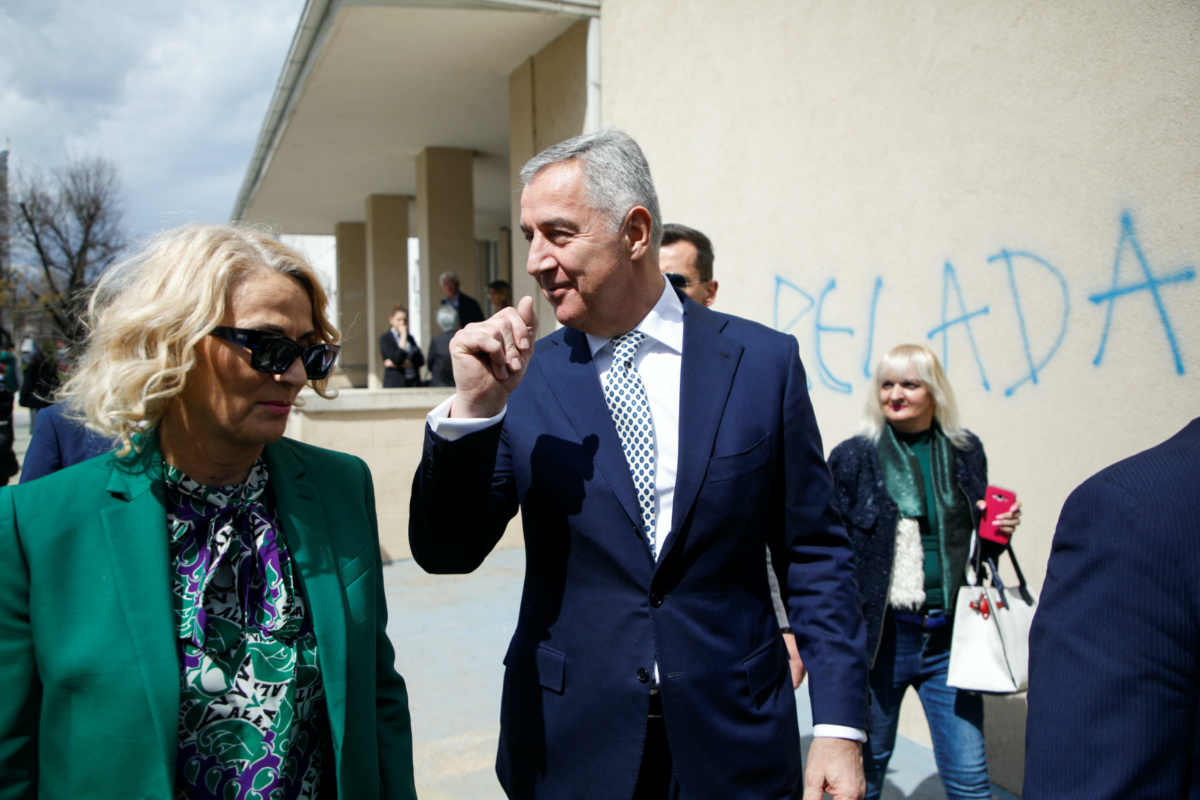 Milo Djukanovic, President of Montenegro and a candidate from the Democratic Party of Socialists, walks with his wife Lidija Kuc as they vote at a polling station during the run-off presidential elections in Podgorica, Montenegro, on 2nd April, 2023.