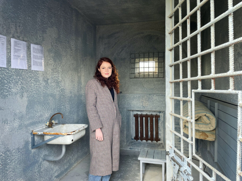 Alexei Navalny's spokeswoman Kira Yarmysh is seen in a replica of the prison cell where the jailed Russian opposition leader is being held, on display as part of the exhibit "Silenced" at Loevestein Castle, the Netherlands, on 30th March, 2023