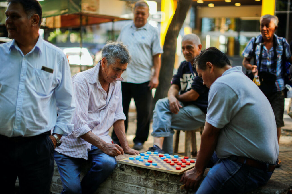 People play checkers in a public square, two days before the presidential election, in Asuncion, Paraguay, on 28th April, 2023.