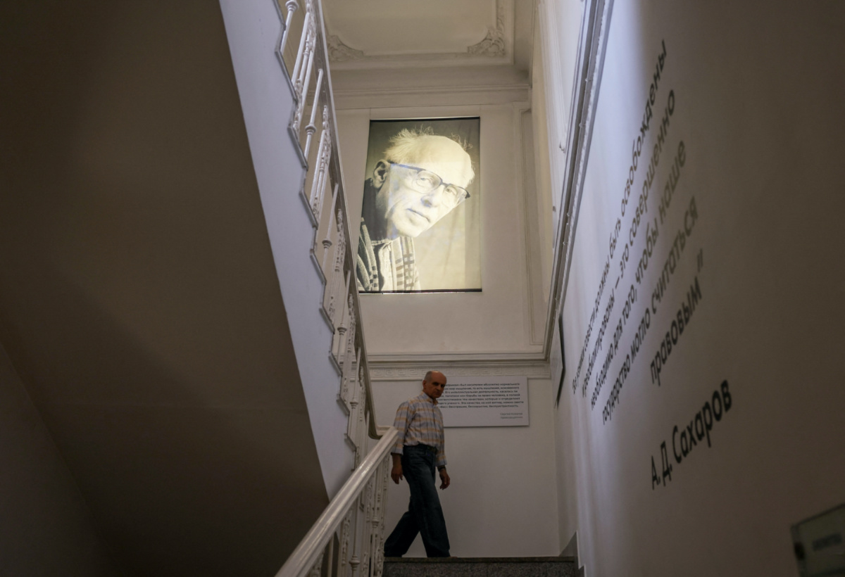 A man walks under a portrait of Nobel laureate and Soviet-era dissident Andrei Sakharov at the Sakharov Centre in Moscow, Russia, on 25th April, 2023.