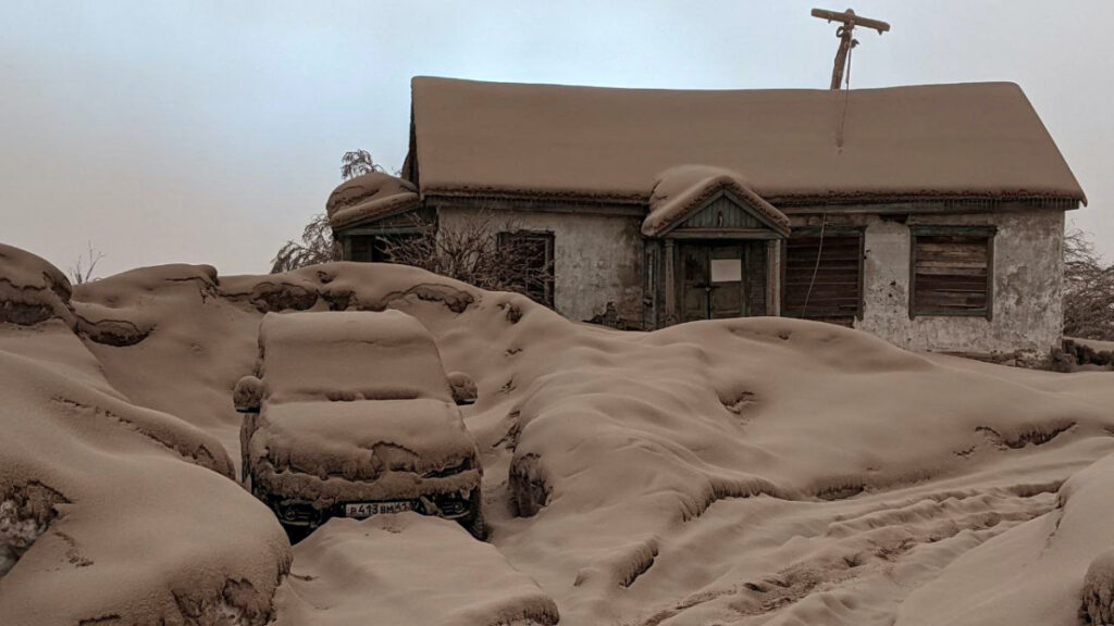 A view shows a house and a car covered in volcanic dust following the eruption of Shiveluch volcano in Kamchatka region, Russia, on 11th April, 2023 in this picture obtained from a handout.