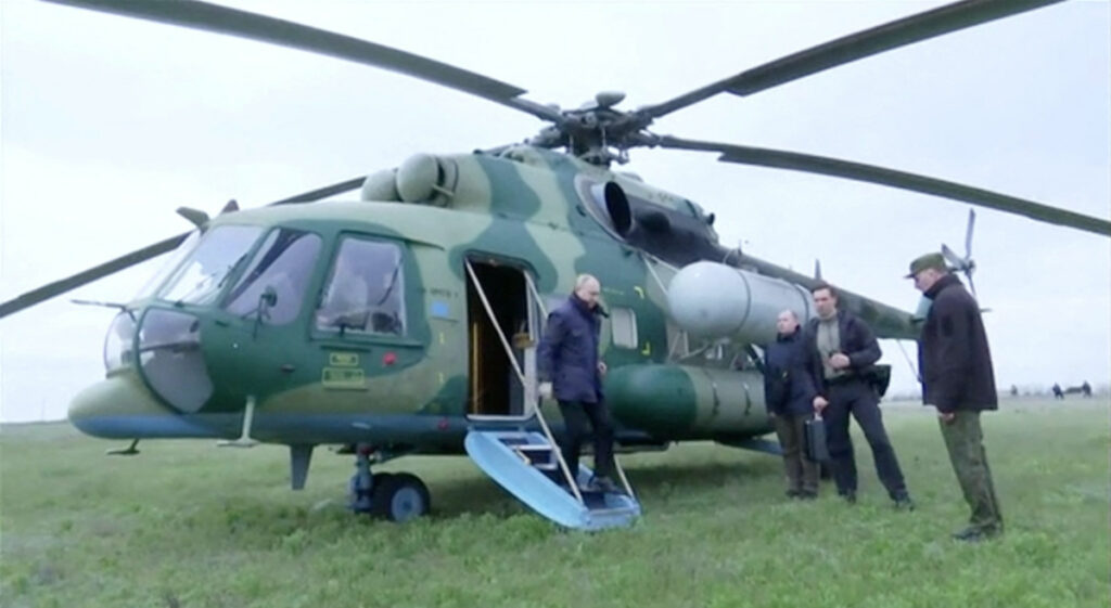 Russian President Vladimir Putin disembarks a helicopter as he visits the headquarters of the Dnieper army group in the Kherson Region, Russian-controlled Ukraine, in this still image taken from handout video released on 18th April, 2023.