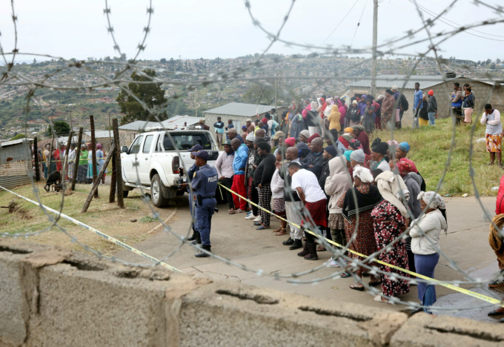 Residents look on at the scene of a deadly mass shooting near Pietermaritzburg, South Africa, on 21st April, 2023.